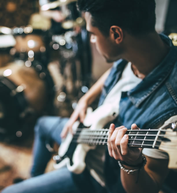 guitar player rehersing with band